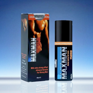 A black cylindrical container of Maxman delay spray held next to its orange and black packaging box. The box features an image of a muscular male torso and the text "Original Extra Strong," "Delay Spray," "T15000," and "With extra strong effect."