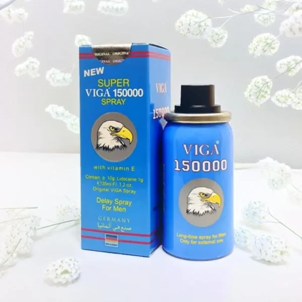 A blue spray bottle labeled "VIGA 150000" with a cartoon eagle logo next to its matching blue packaging box, which features similar branding and information about the product. The spray is intended for men to treat premature ejaculation and is marked as a delay spray for external use.