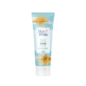 Rice Milk Face Wash tube with natural ingredients like rice and milk in the background